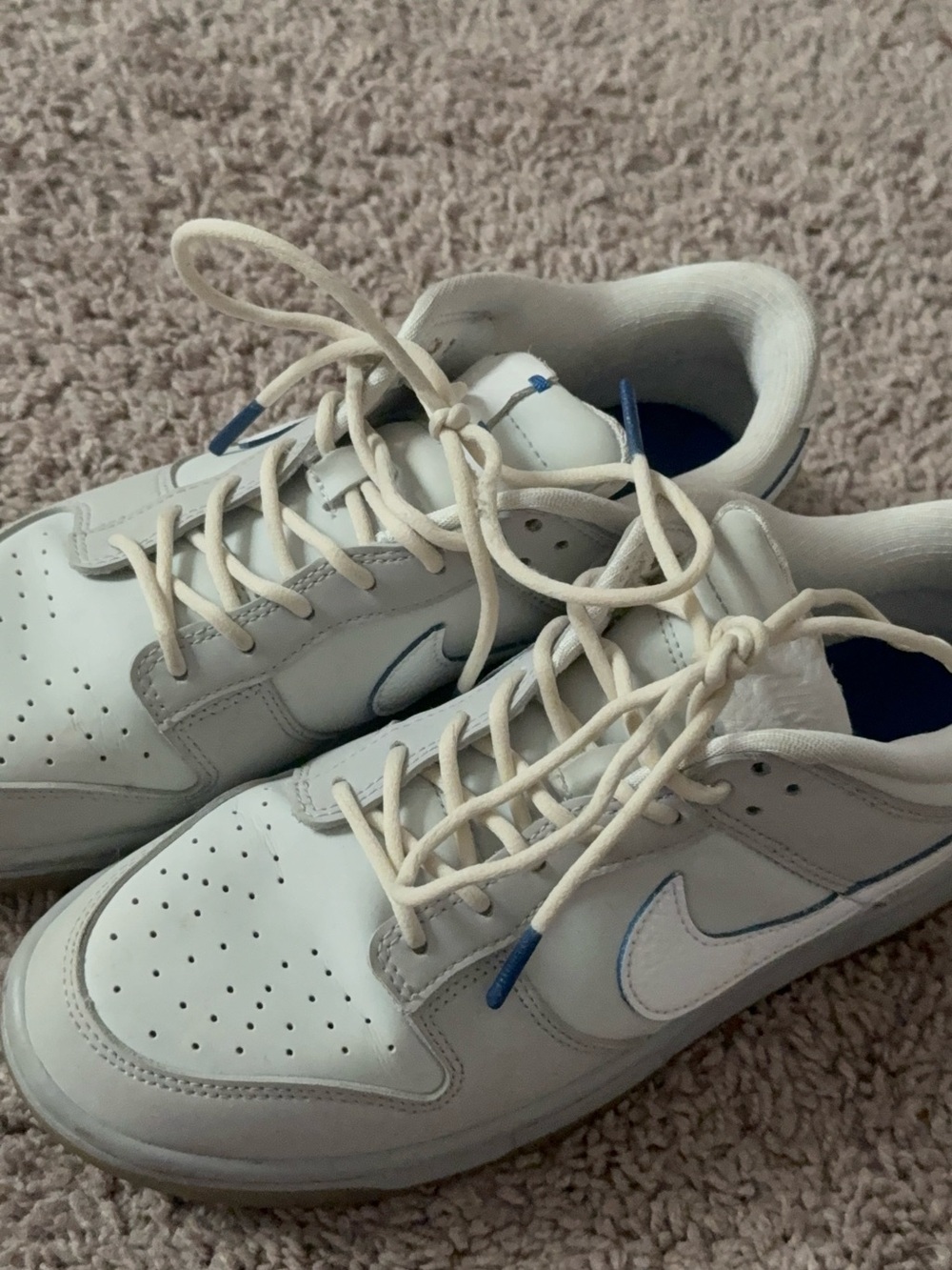 Nike Men’s White Sneakers with Blue Accents